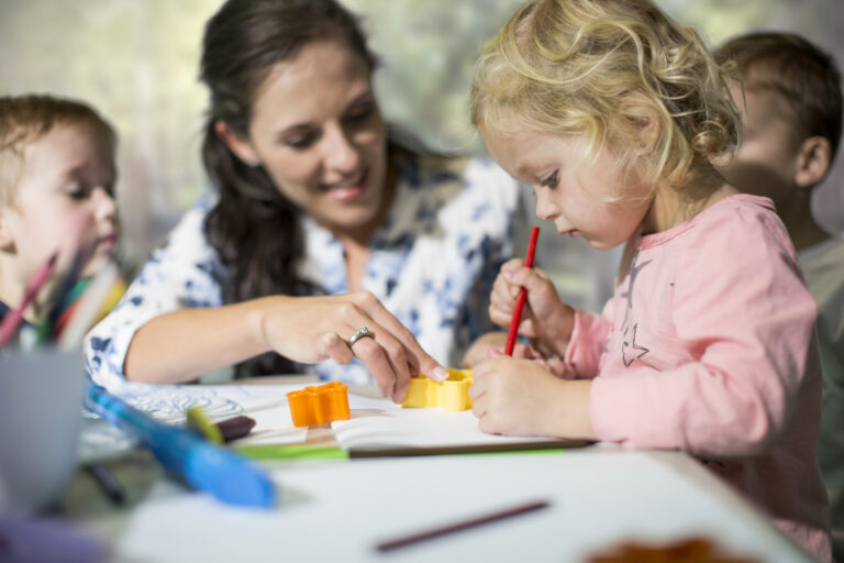 Teacher and children drawing